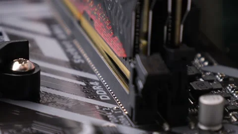 A random-access memory, RAM installs in the socket on motherboard. PC hardware Stock Footage 195155165