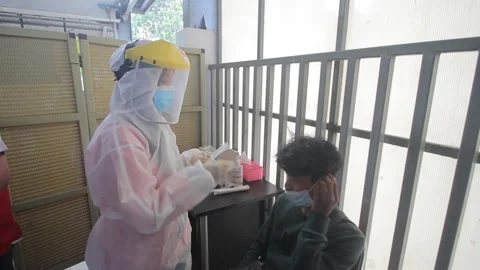 RANDOM ANTIGEN SWAP TEST AT TANAH ABANG STATION, JAKARTA Stock Footage 156018922