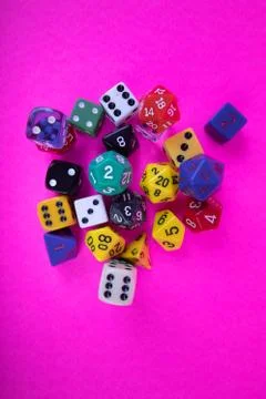 Random assorted game dice colorful different sizes Stock Photos