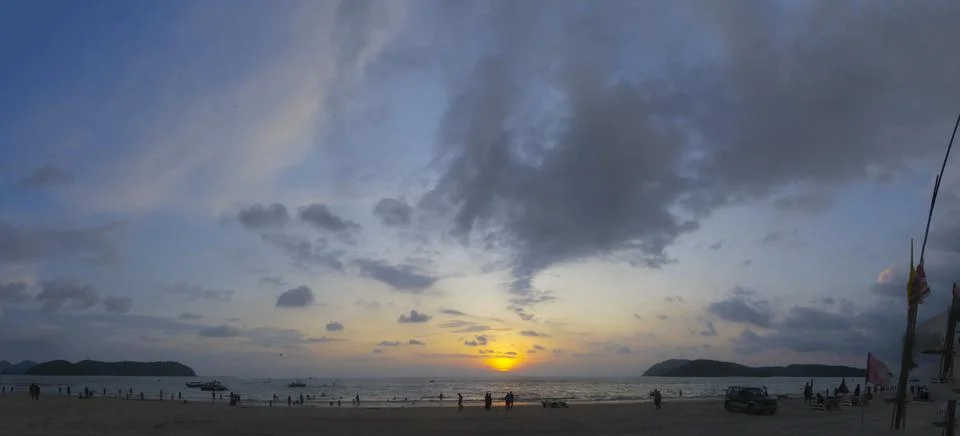 Random clouds with orange sun at sunset in Langkawi Island Malaysia Stock Photos