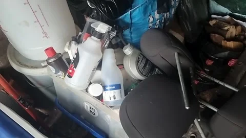 Random collection of stacked untidy household clutter and workshop tools Video stock 336813843