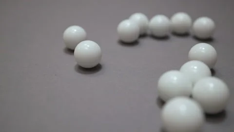 Random collisions of white balls on the gray suface Stock Footage 147109677