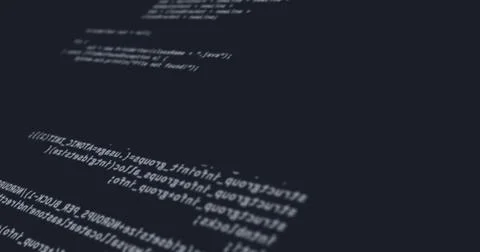 Random computer codes projected on the screen while being written or typed Stock Photos