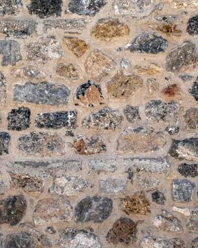 Random cut stone wall closeup, natural textured background Foto stock