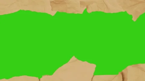 A random cutting for crumpled yellow paper reveals green screen Stock Footage 308238511