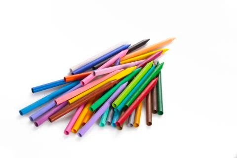 Random heap of rainbow colored wax pencil crayons Stock Photos