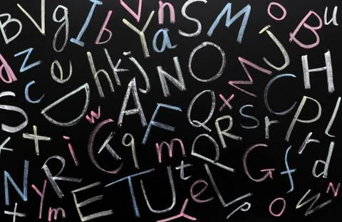 Random letters on a blackboard Stock Photos