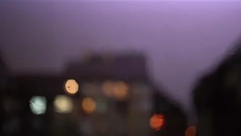 Random Lightning With Rain On The Window With Blury Background Lights Stock Footage 161786254