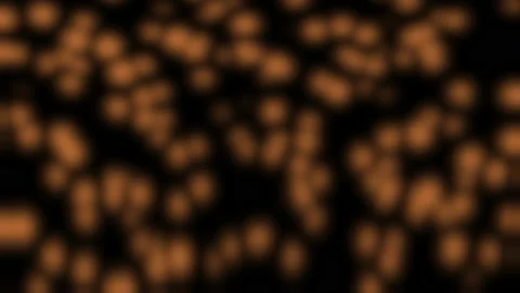 Random motion of particles of glittering particles in bokeh over black Stock Footage 130423027