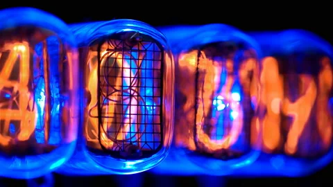 Random numbers change on the numerical counter, on Gas discharge indicator Stock Footage 104446806