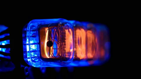 Random numbers change on the numerical counter, on Gas discharge indicator Stock Footage 104450795