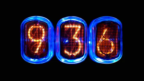 Random numbers change on the numerical counter, on Gas discharge indicator Stock Footage 104460227