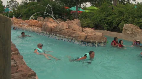 Random People Enjoying Lazy River at Water Park Stock Footage 30394397