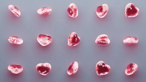 Random rotating pink glassy 3d hearts pattern. Stock Footage 300256521