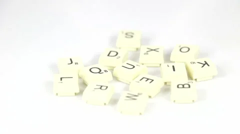 Random scrabble letters rotating on white background Stock Footage 40388177