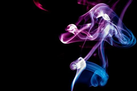 Random shapes of colored smoke fired with colored flash Stock Photos