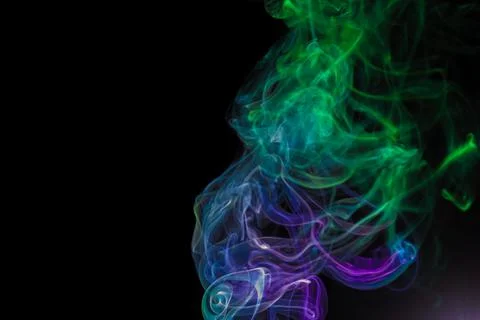 Random shapes of colored smoke fired with colored flash Stock Photos