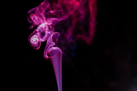 Random shapes of colored smoke fired with colored flash Stock Photos