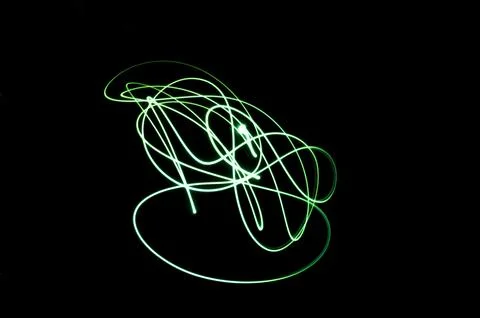 Random shapes made with light paint photographic technique on black backgroun Illustrazione stock