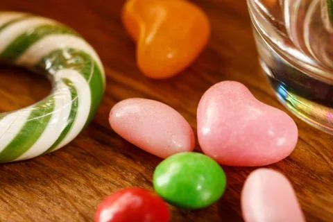 Randomly scattered candy on the table. Close-up. Bright picture. Stock Photos