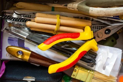 Randomly stacked art tools. Close up top view. Stock Photos