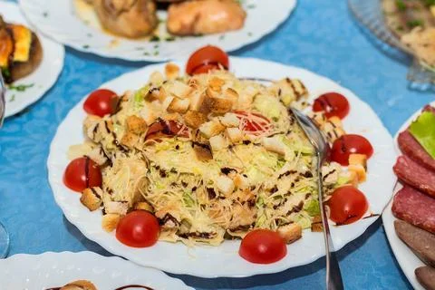 The range of different dishes on the table with a blue tablecloth, restaura.. Stock Photos