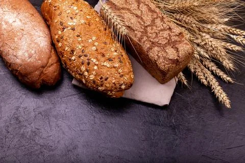 The range of different types of bread from rye and wheat flour. Fotos de archivo