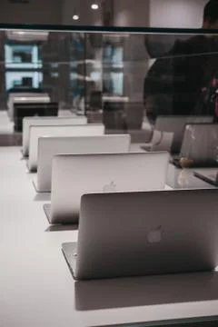 Range of MacBooks on display inside Apple Museum in Prague,Czech Republic. Stock Photos