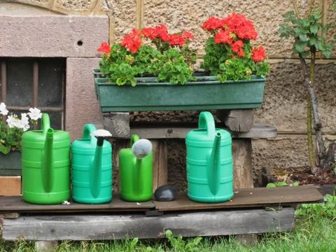 Range of plastic watering cans Stock Photos