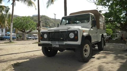 Range Rover Defender Classic pickup truck with roofing Stock Footage 160502691