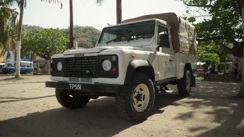 Range Rover Defender Classic pickup truck with roofing Stock Footage 160502714
