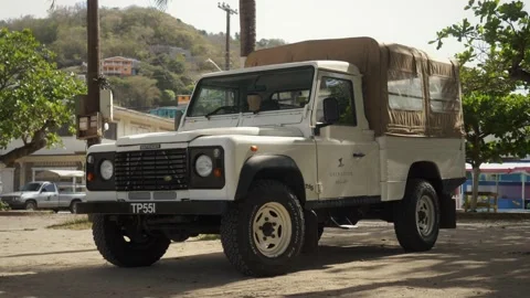 Range Rover Defender Classic pickup truck with roofing Stock Footage 160502735