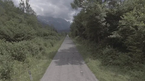 Range rover defender driving near moutnain, aerial drone view Video stock 100604945