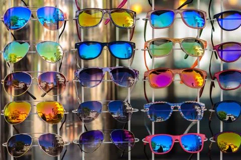 Range of sun glasses on rack Stock Photos