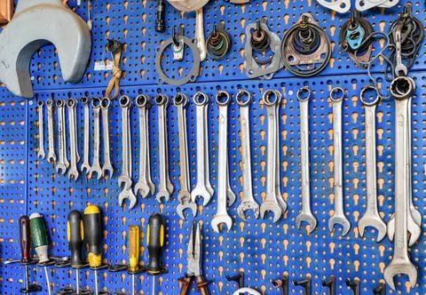 A range of used mechanic tools, from combination wrenches to plier and screwd Stock Photos