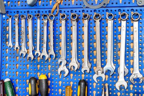 A range of used mechanic tools, from combination wrenches to screwdrivers. Stock Photos