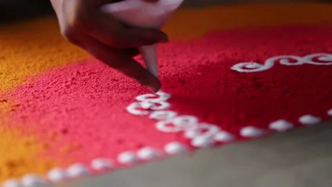 Rangoli with coloured powder being created by Rangoli artist,Mumbai,India. Stock Footage 74156919