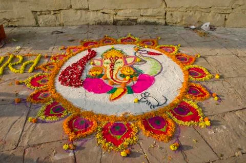 Rangoli making during dev diwali Stock Photos