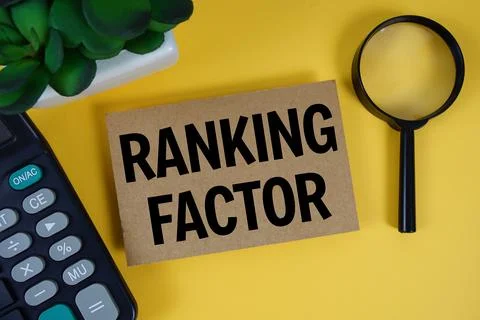 Ranking Factor text with magnifying glass anc calculator on yellow background Foto stock