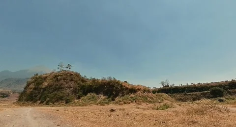 Ranu Manduro 08, rolling hills covered in grass. Stock Footage 282529044