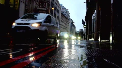 Raod Traffic in the rain Stock Footage 67677175