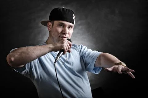 Rap singer man with microphone cool hand gesture Stock Photos