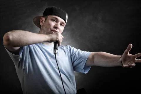 Rap singer man with microphone cool hand gesture Stock Photos