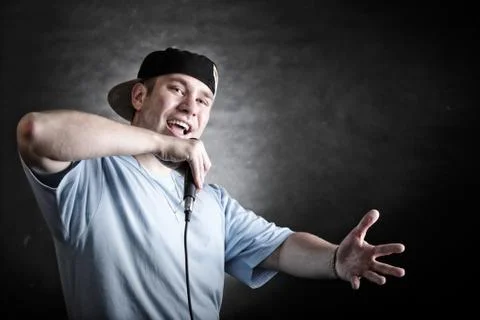Rap singer man with microphone cool hand gesture Stock Photos