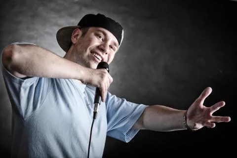 Rap singer man with microphone cool hand gesture Stock Photos