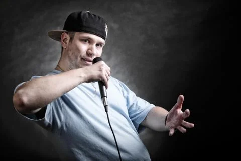 Rap singer man with microphone cool hand gesture Stock Photos