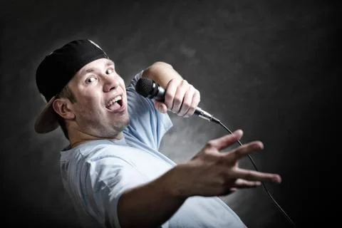 Rap singer man with microphone cool hand gesture Stock Photos