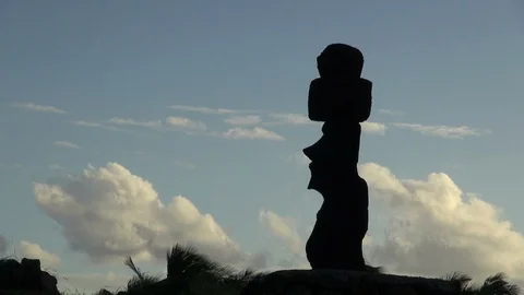 Rapa Nui Ahu O Rongo modern carving silhouette with clouds Stock Footage 128721013