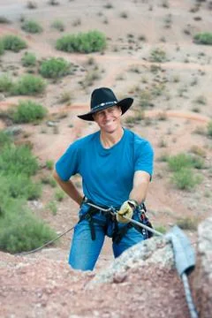 Rapelling rock climber Stock-Fotos