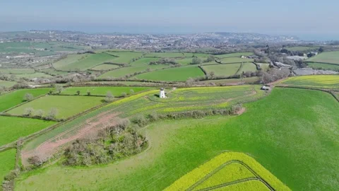 Rapeseed Fields and Farms over Torquay from a drone, Devon, England, Europe Stockbeeldmateriaal 312415482